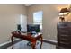 Bright home office with wood desk and window view at 348 165Th Ne Ct, Bradenton, FL 34212