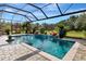Inviting swimming pool with water features and screened enclosure at 348 165Th Ne Ct, Bradenton, FL 34212