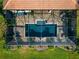 Aerial view of the pool and surrounding patio area at 348 165Th Ne Ct, Bradenton, FL 34212