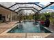Inviting pool area with covered lanai and spacious patio at 348 165Th Ne Ct, Bradenton, FL 34212