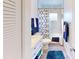 Clean bathroom, featuring a bathtub shower, white vanity, and blue accents at 3522 Silver Pine Ct # 90, Sarasota, FL 34231