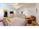 Spacious bedroom with dresser, seating and ensuite bathroom at 3522 Silver Pine Ct # 90, Sarasota, FL 34231