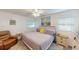 Main bedroom with large bed, seating, and ample closet space at 3522 Silver Pine Ct # 90, Sarasota, FL 34231