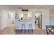 Kitchen with breakfast bar and view into living area at 3522 Silver Pine Ct # 90, Sarasota, FL 34231