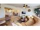 Open living room, dining area, and kitchen with new flooring at 3522 Silver Pine Ct # 90, Sarasota, FL 34231