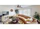 Living room with curved sectional sofa and flat screen TV at 3522 Silver Pine Ct # 90, Sarasota, FL 34231