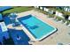 Community pool with plenty of surrounding deck space for sunbathing at 3522 Silver Pine Ct # 90, Sarasota, FL 34231