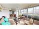 Bright sunroom features comfortable seating and serene views at 3522 Silver Pine Ct # 90, Sarasota, FL 34231