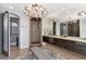 Spa-like bathroom with double vanities and a large walk-in shower at 378 Golden Gate Pt # 6, Sarasota, FL 34236