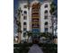 White building with arched windows, palm trees, and a walkway at 378 Golden Gate Pt # 6, Sarasota, FL 34236