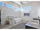 Elegant bathroom featuring a freestanding tub and marble shower at 3939 Higel Ave, Sarasota, FL 34242