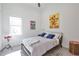 Cozy bedroom featuring a double bed and large window at 3939 Higel Ave, Sarasota, FL 34242