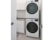 Laundry room with stackable washer and dryer at 3939 Higel Ave, Sarasota, FL 34242