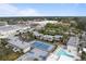 Aerial view showing community amenities, including pool and tennis court at 4001 Beneva Rd # 304, Sarasota, FL 34233