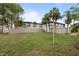 Private backyard with screened patio and grassy area at 4001 Beneva Rd # 304, Sarasota, FL 34233