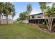 Private backyard with screened patio and grassy area at 4001 Beneva Rd # 304, Sarasota, FL 34233