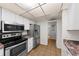 Updated kitchen with stainless steel appliances and granite countertops at 4001 Beneva Rd # 304, Sarasota, FL 34233