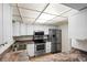Well-equipped kitchen featuring stainless steel appliances and white cabinets at 4001 Beneva Rd # 304, Sarasota, FL 34233