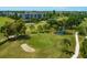 Aerial view of golfers on the course and surrounding area at 4110 Ironwood Cir # 301, Bradenton, FL 34209