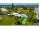 Aerial view of community pool, shuffleboard, and golf course at 4110 Ironwood Cir # 301, Bradenton, FL 34209