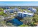 Aerial view of the community, showing the building and a pond at 4110 Ironwood Cir # 301, Bradenton, FL 34209