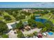 Aerial view of golf course and clubhouse with parking lot at 4110 Ironwood Cir # 301, Bradenton, FL 34209