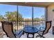 Relaxing balcony with lake view and seating for two at 4110 Ironwood Cir # 301, Bradenton, FL 34209