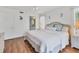 Comfortable king bedroom with light flooring and ceiling fan at 4110 Ironwood Cir # 301, Bradenton, FL 34209
