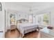 King-size bedroom with wood flooring and ceiling fan at 4110 Ironwood Cir # 301, Bradenton, FL 34209