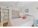 Bedroom with ensuite bathroom access, a comfortable bed, and built in closet at 4110 Ironwood Cir # 301, Bradenton, FL 34209