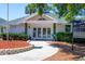 Inviting clubhouse entrance with landscaping and walkway at 4110 Ironwood Cir # 301, Bradenton, FL 34209