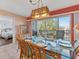 Spacious dining area with glass top table and view of bedroom at 4110 Ironwood Cir # 301, Bradenton, FL 34209