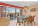 Charming dining area with balcony access and coastal decor at 4110 Ironwood Cir # 301, Bradenton, FL 34209