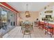 Bright dining room with glass table and access to a balcony at 4110 Ironwood Cir # 301, Bradenton, FL 34209