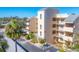 Exterior view of a three-story condo building with parking and landscaping at 4110 Ironwood Cir # 301, Bradenton, FL 34209