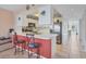 Bright kitchen with stainless steel appliances and an island with seating at 4110 Ironwood Cir # 301, Bradenton, FL 34209