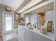 Elegant bathroom with double vanity and walk-in shower at 4472 Via Del Villetti Dr, Venice, FL 34293