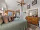 Bedroom with king-size bed and wooden dresser at 4472 Via Del Villetti Dr, Venice, FL 34293