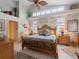 Main bedroom with king-size bed and tropical decor at 4472 Via Del Villetti Dr, Venice, FL 34293