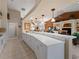 Spacious kitchen with white cabinets and expansive island at 4472 Via Del Villetti Dr, Venice, FL 34293