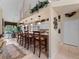 Kitchen with breakfast bar, white cabinets, and stainless steel appliances at 4472 Via Del Villetti Dr, Venice, FL 34293