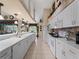 White kitchen with ample counter space and stainless steel appliances at 4472 Via Del Villetti Dr, Venice, FL 34293