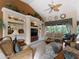 Comfortable living area with built-in shelving and a view of the pool at 4472 Via Del Villetti Dr, Venice, FL 34293