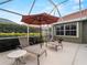Spacious patio with lounge chairs and small table at 4472 Via Del Villetti Dr, Venice, FL 34293