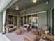 Covered patio overlooking the pool and backyard at 4472 Via Del Villetti Dr, Venice, FL 34293