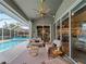 Inviting poolside patio with seating and access to the pool at 4472 Via Del Villetti Dr, Venice, FL 34293