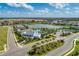 Aerial view of community with lake, pool, and clubhouse at 4514 Big Woods Way, Parrish, FL 34219