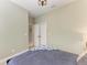 Spacious bedroom with a bed and access to hallway at 4514 Big Woods Way, Parrish, FL 34219