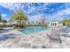 Resort-style pool with lounge chairs and palm trees at 4514 Big Woods Way, Parrish, FL 34219
