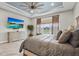 Main bedroom with large window, TV, dresser, and king-size bed at 4534 Trento Pl, Bradenton, FL 34211